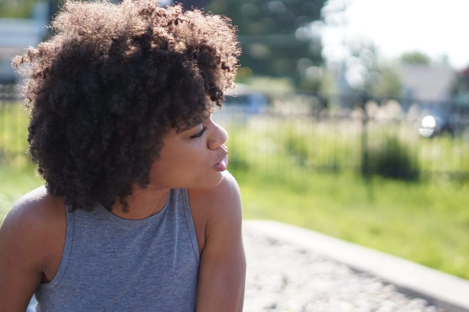Woman with a full, rounded afro of tightly coiled type 4 hair