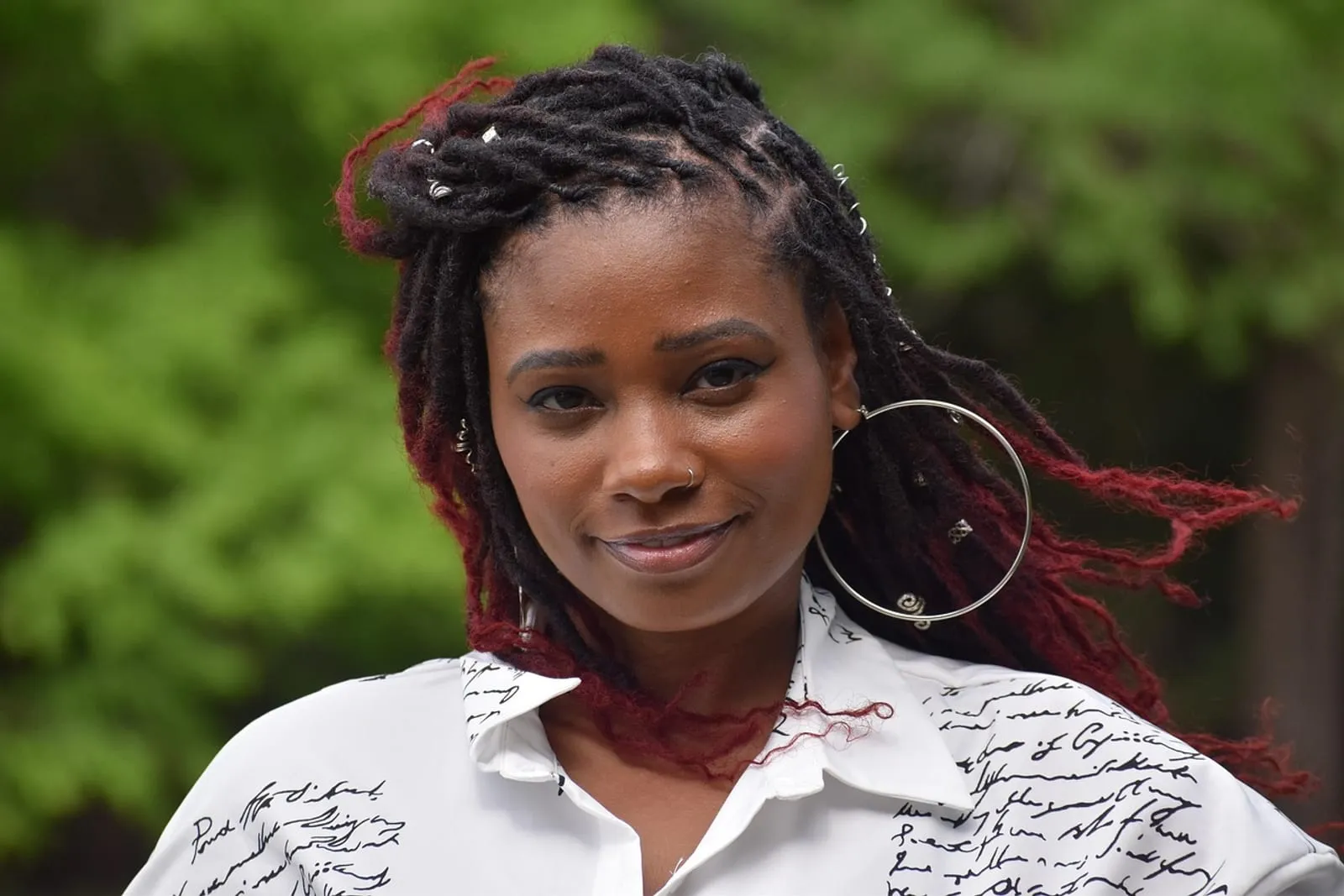 Woman in a cozy knit sweater with neatly styled hair