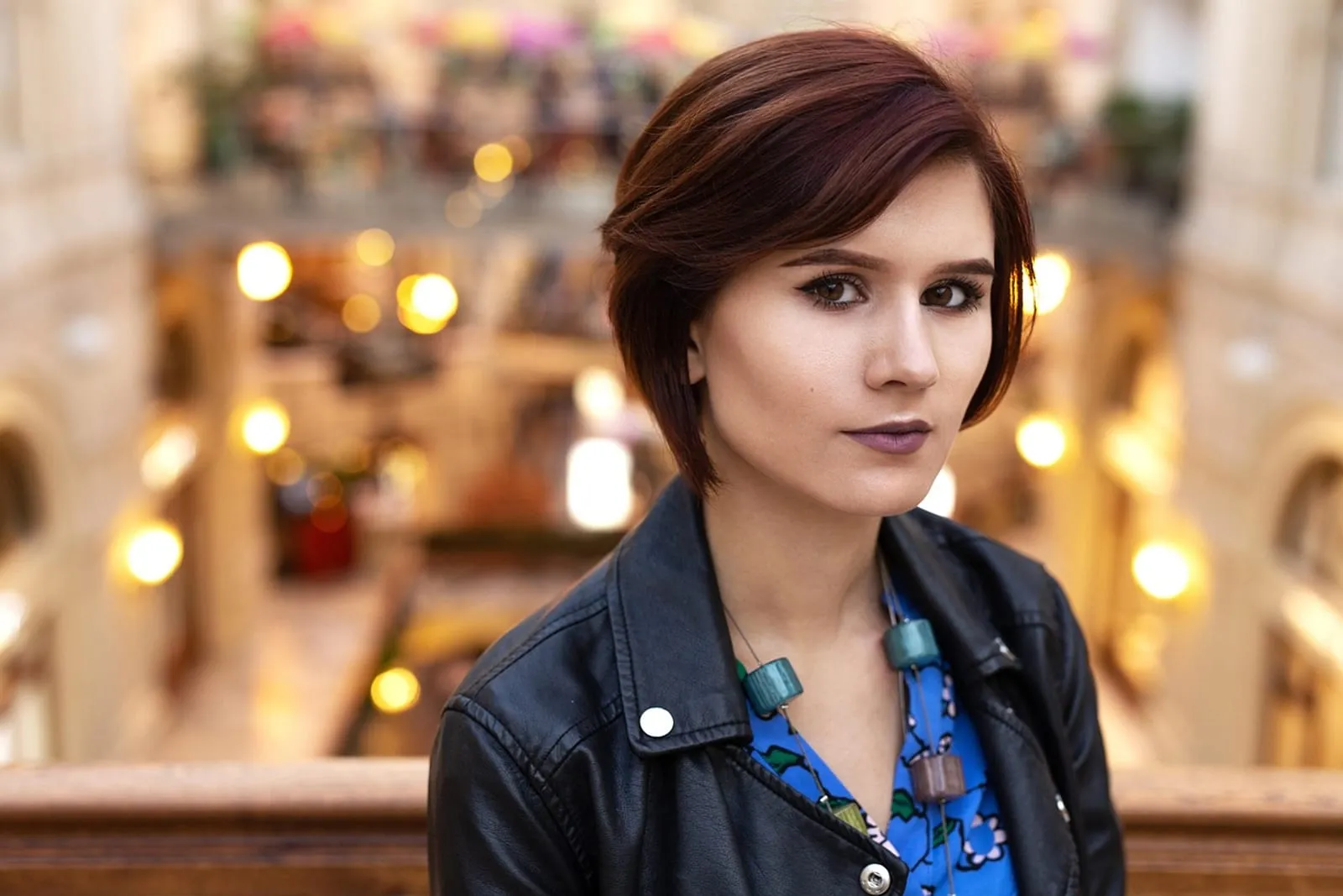 Woman with short hair in a headshot